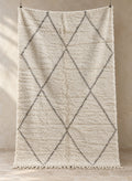 Handmade ivory Beni Ourain rug with black diamond pattern, full view