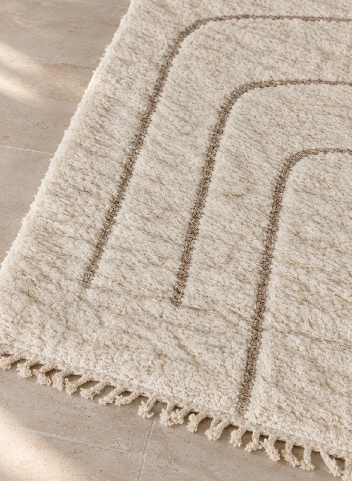 Close-up of the fringe of the Mrirt rug
