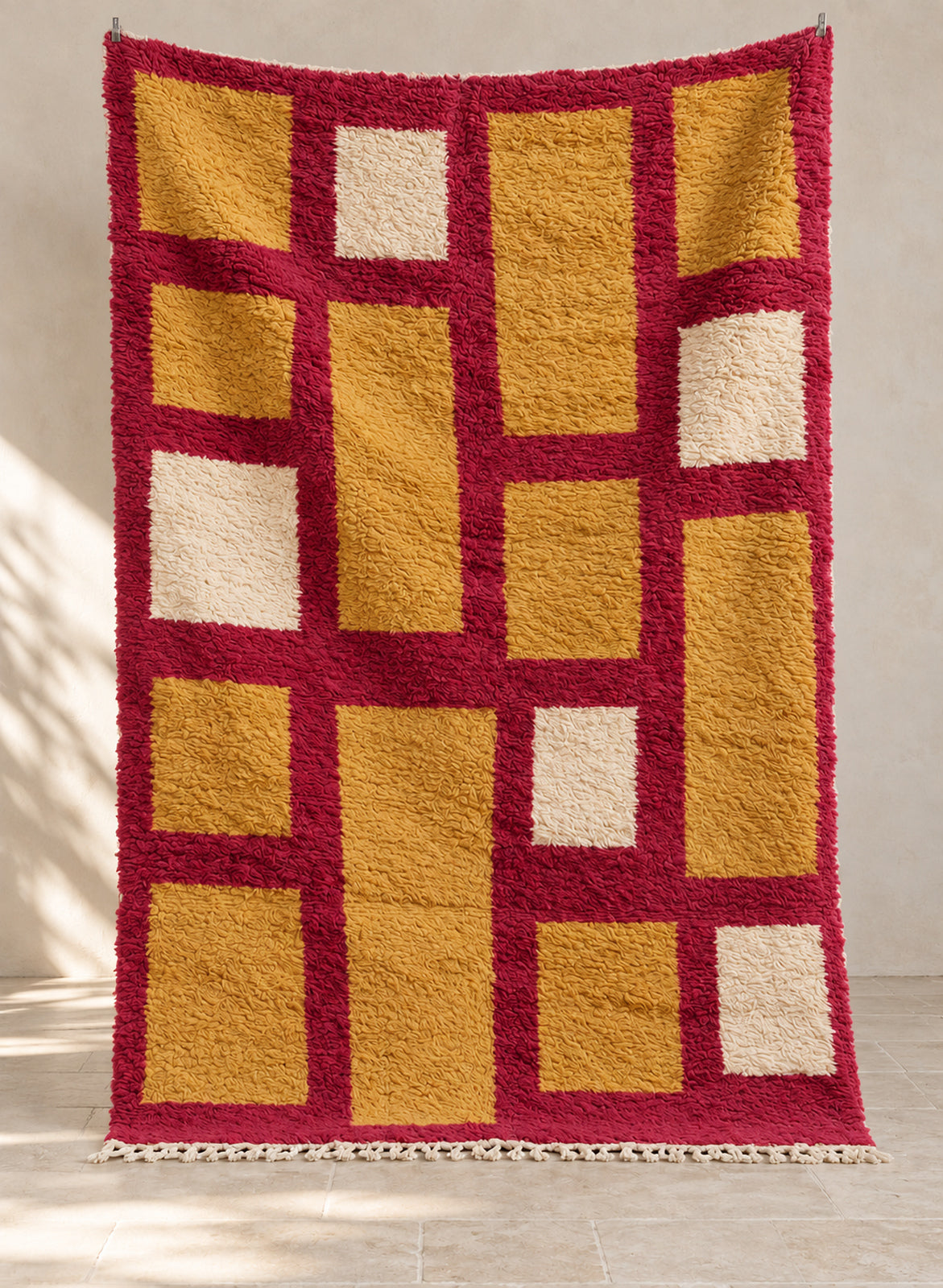 Raspberry Boujaad rug with a mustard and cream grid, full view