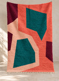 Coral Boujaad rug with angular teal shapes, full view