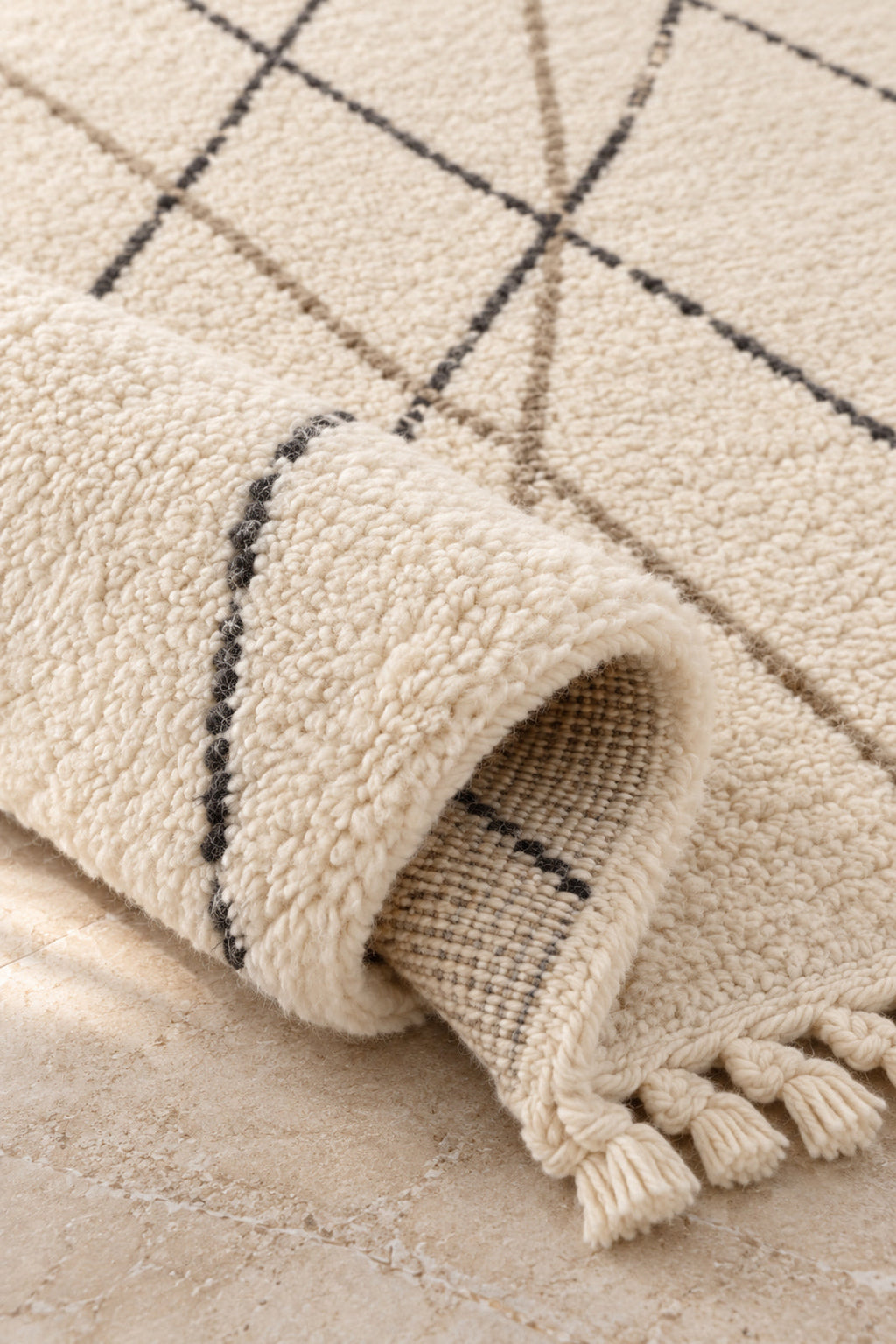 Thick pile of Beni Ourain rug model 07 on a folded corner