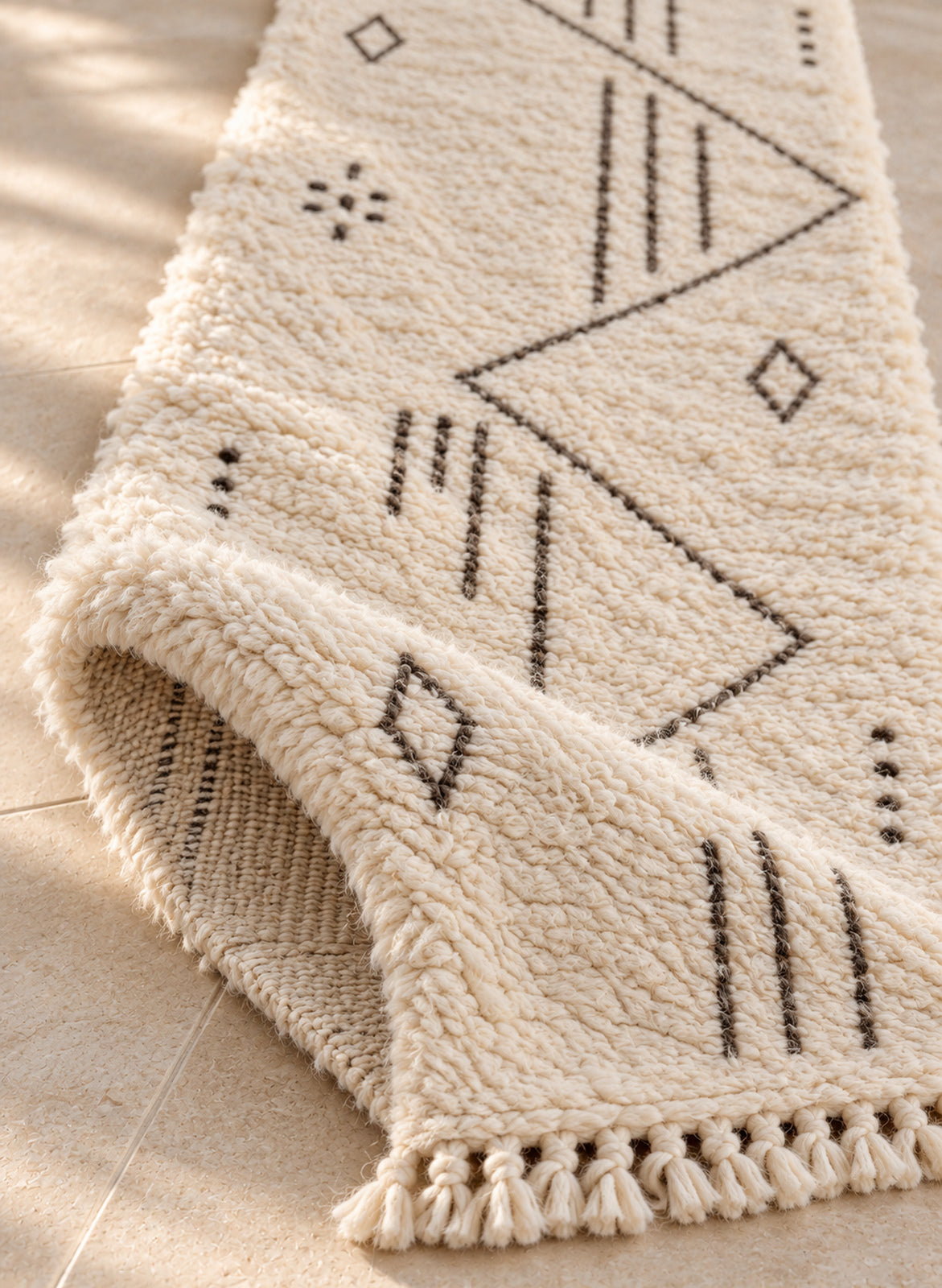 Folded Beni Ourain runner showing pile thickness