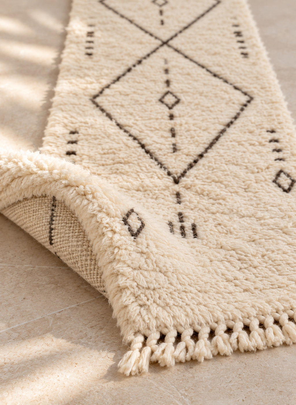 Folded Beni Ourain runner showing pile thickness