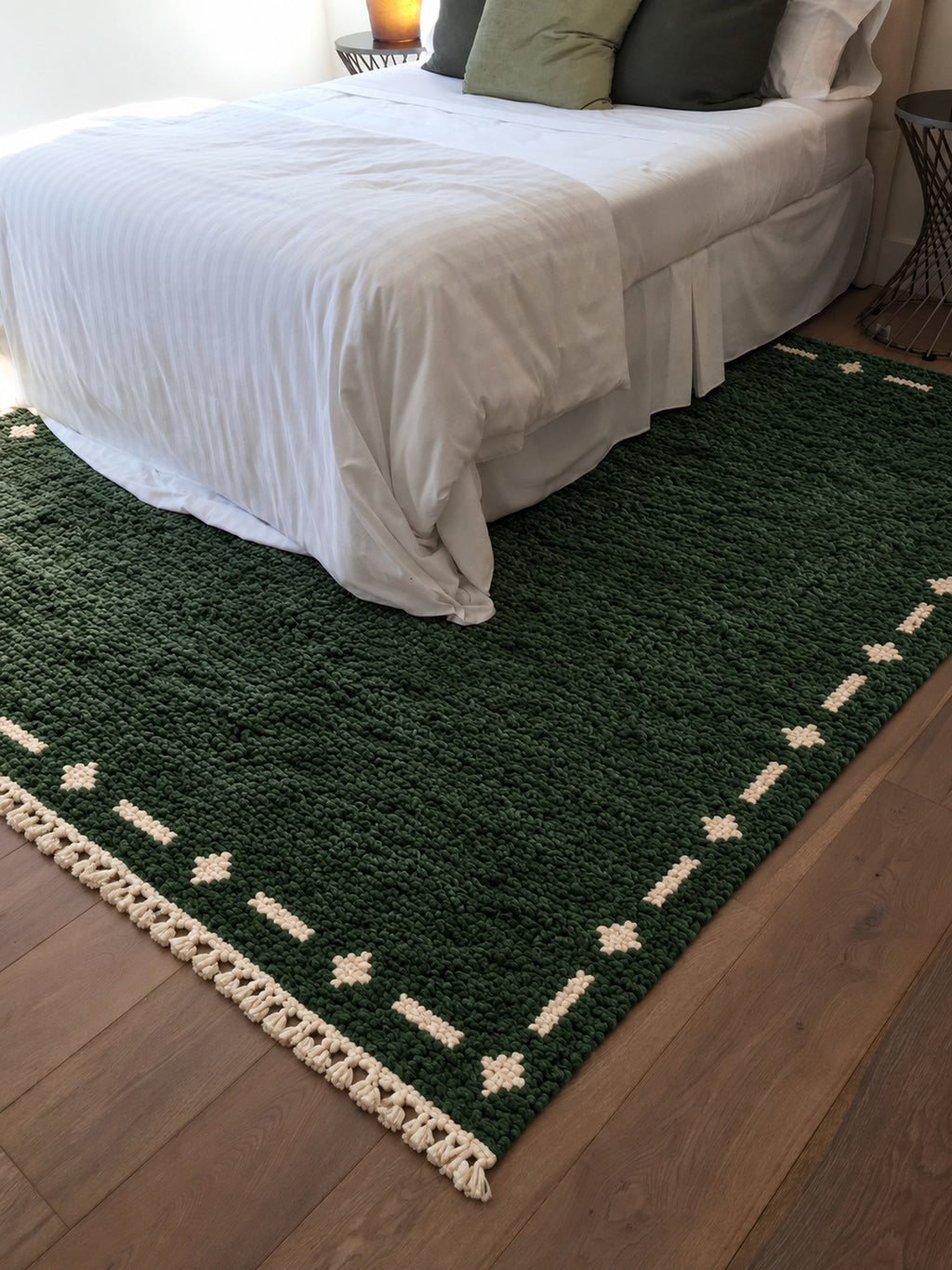 Forest Green Beni Ourain rug with an ivory dashed border in a styled interior