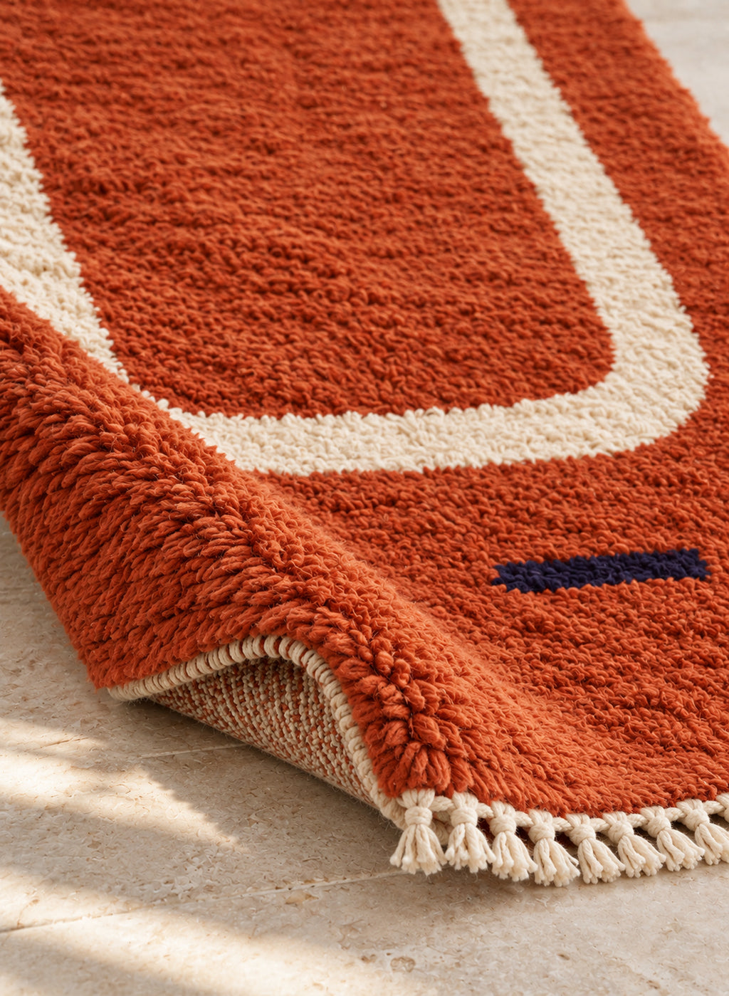 Thick pile of Beni Ourain rug model BWO-05 on a folded corner