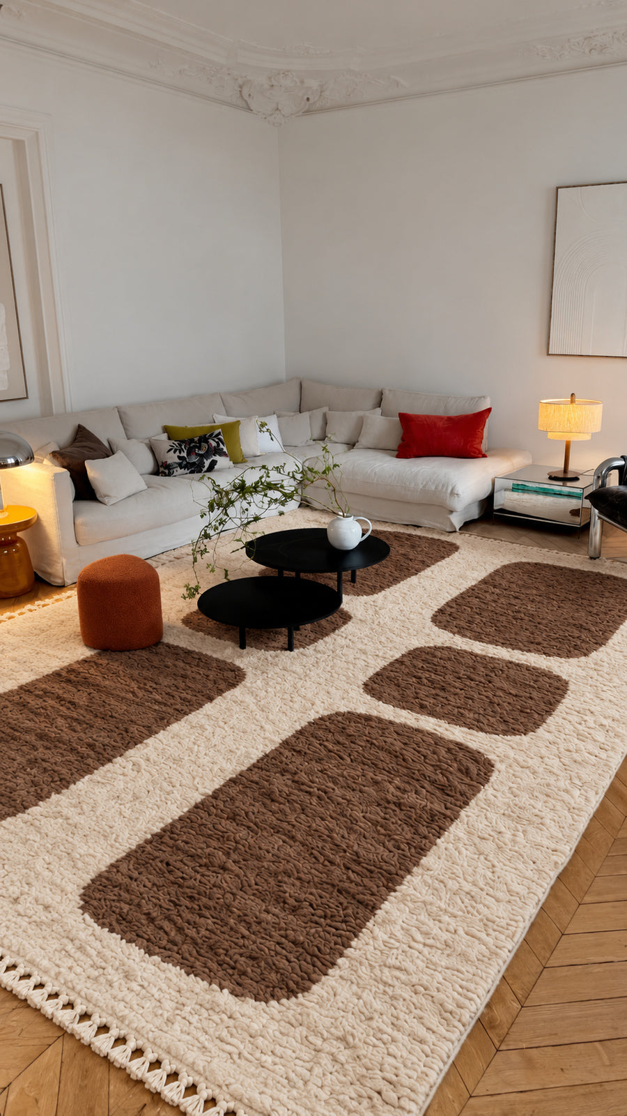 Ivory Beni Ourain rug with brown pebble blocks in a styled interior