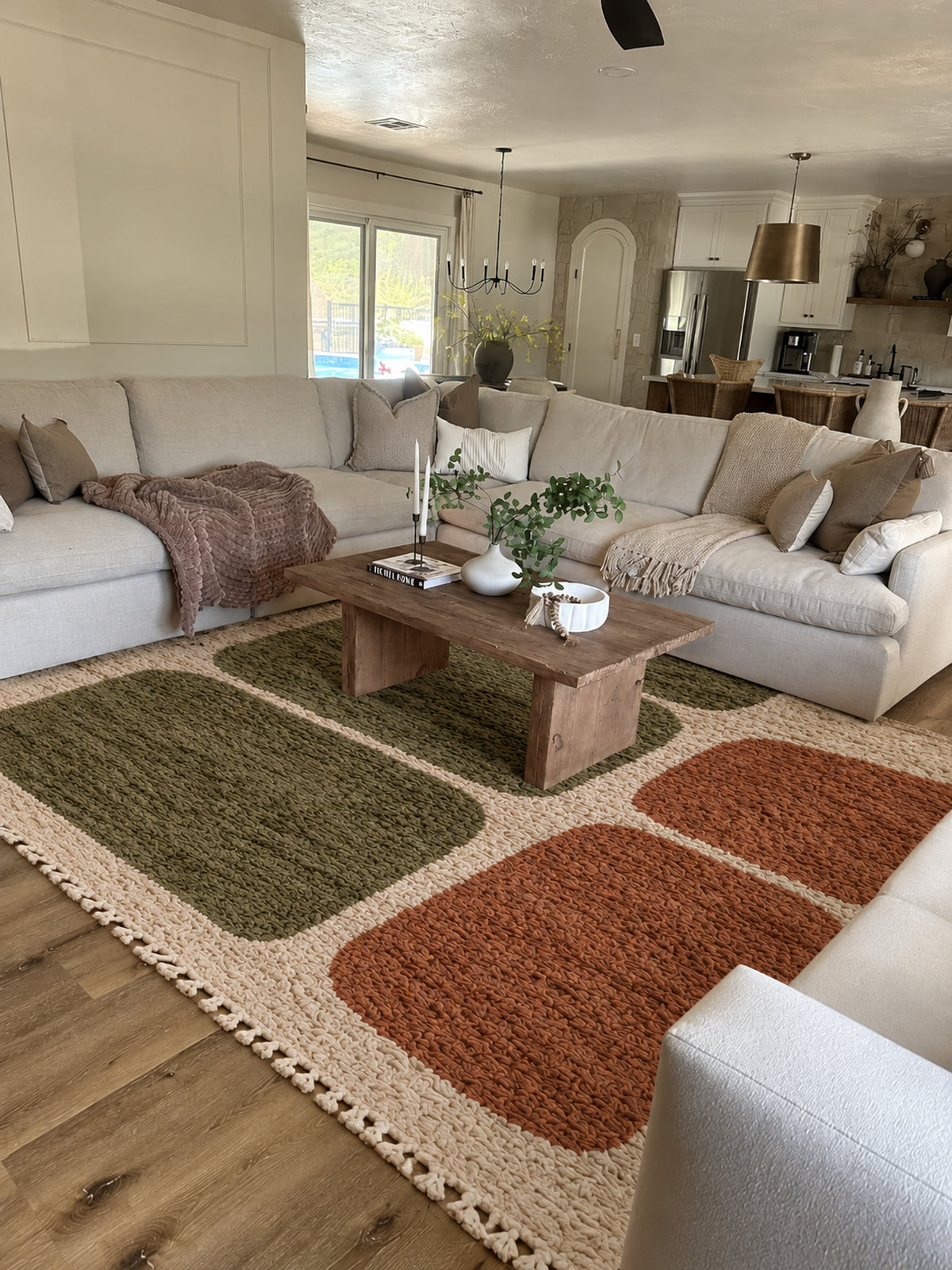 Ivory Beni Ourain rug with olive and rust pebble shapes in a styled interior