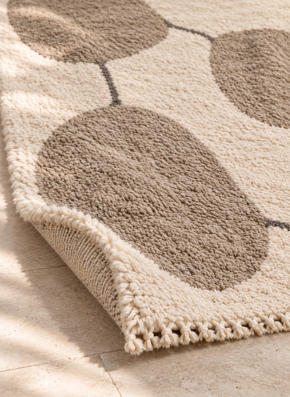 Thick pile of Beni Ourain rug model BWO-10 on a folded corner