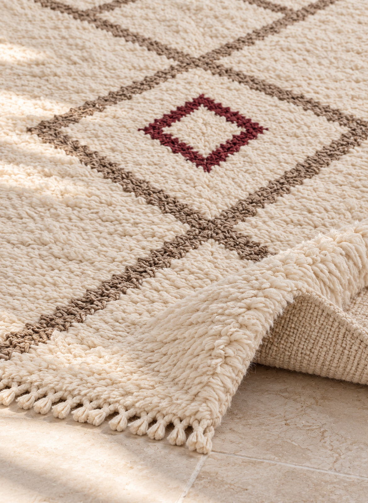 Thick pile of Beni Ourain rug model BWO-21 on a folded corner