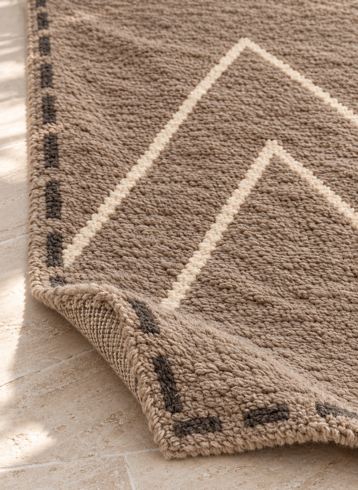 Thick pile of Beni Ourain rug model BWO-26 on a folded corner