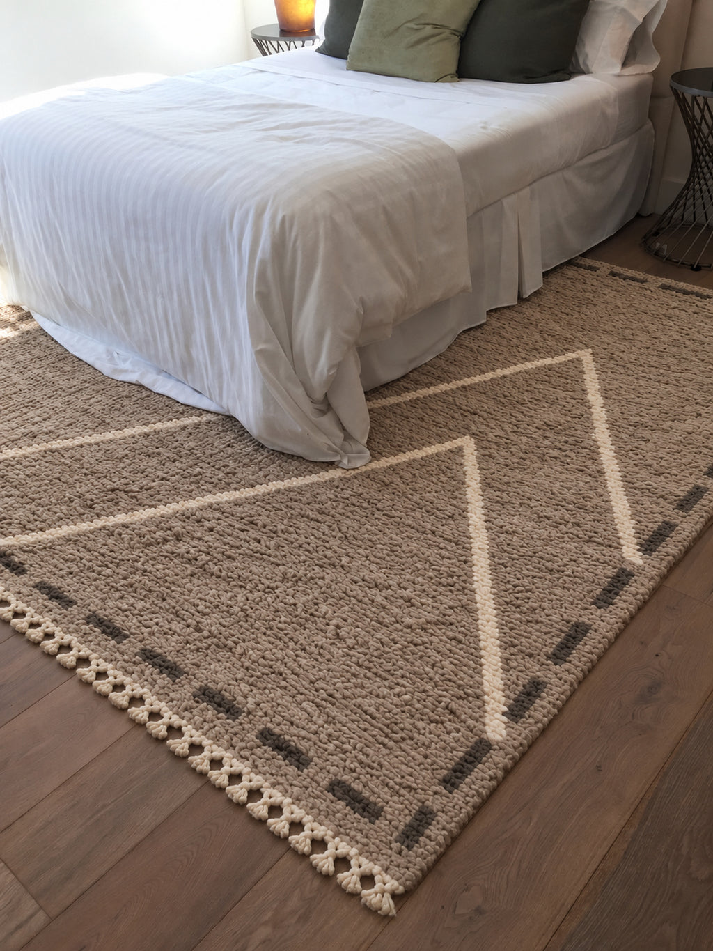 Taupe Beni Ourain rug with ivory triangles inside a frame in a styled interior