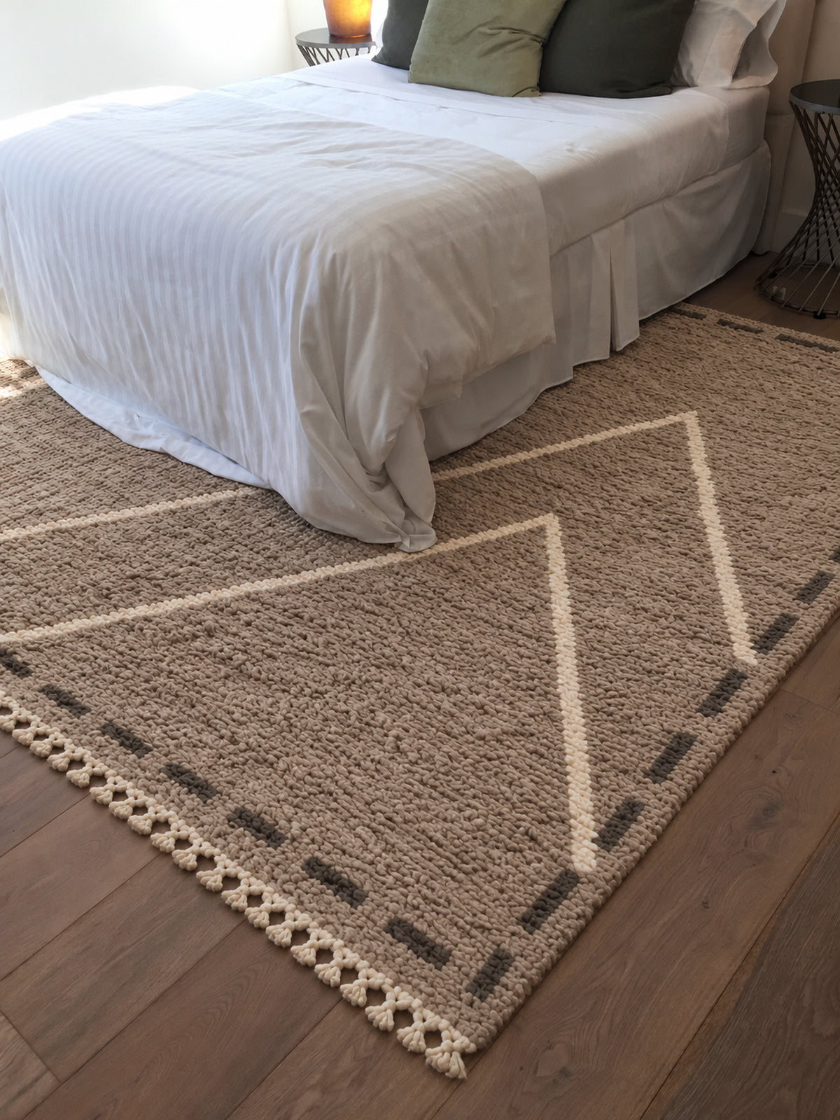Taupe Beni Ourain rug with ivory triangles inside a frame in a styled interior