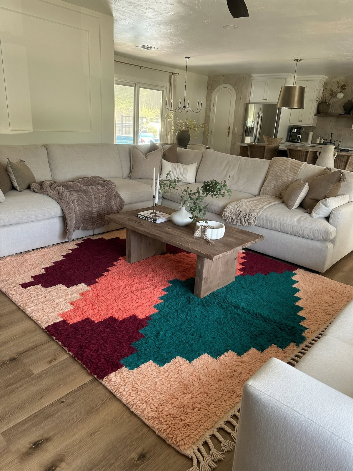 Peach Asif Boujaad rug with stacked diamonds in a living room