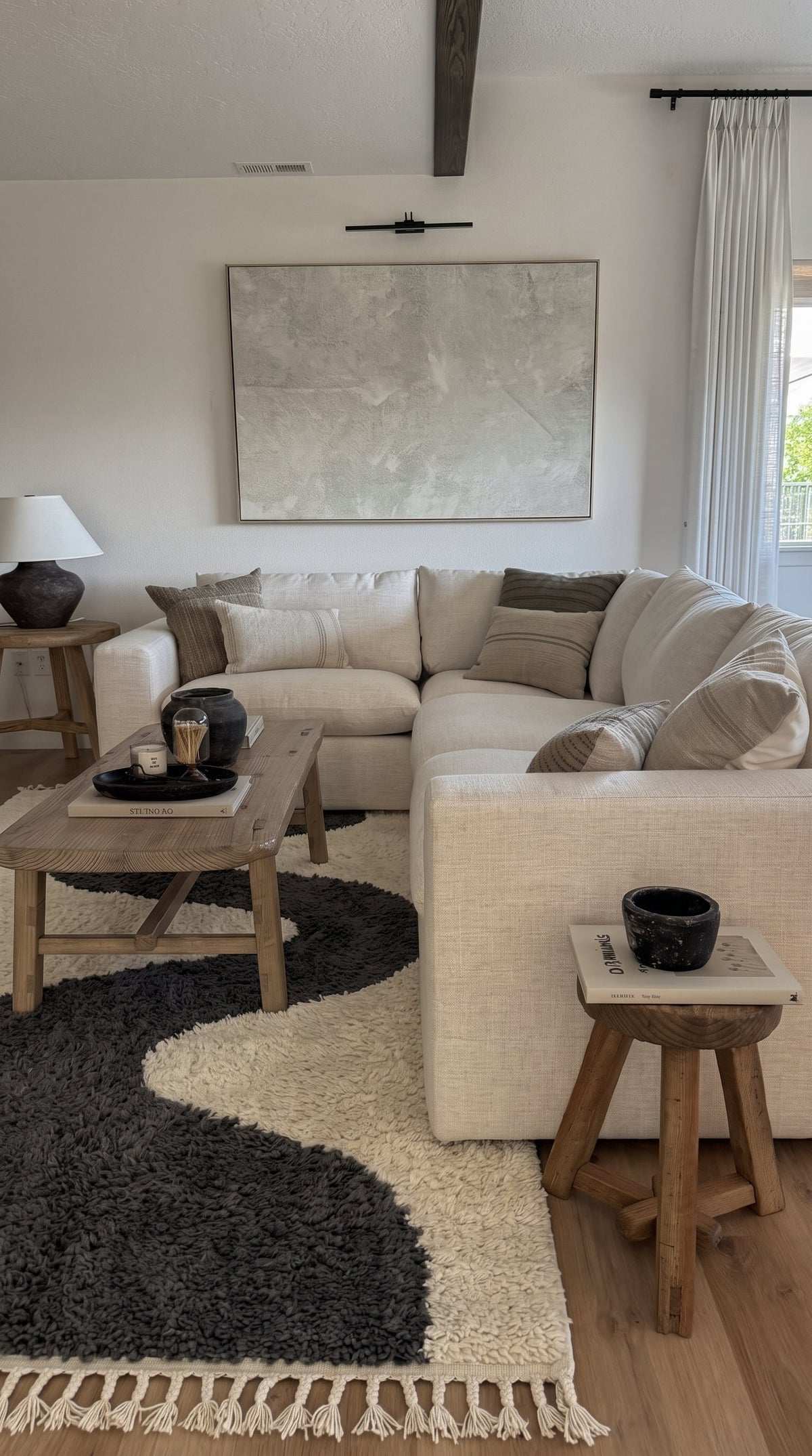 Charcoal Mrirt rug model 04 with a wave motif in a living room
