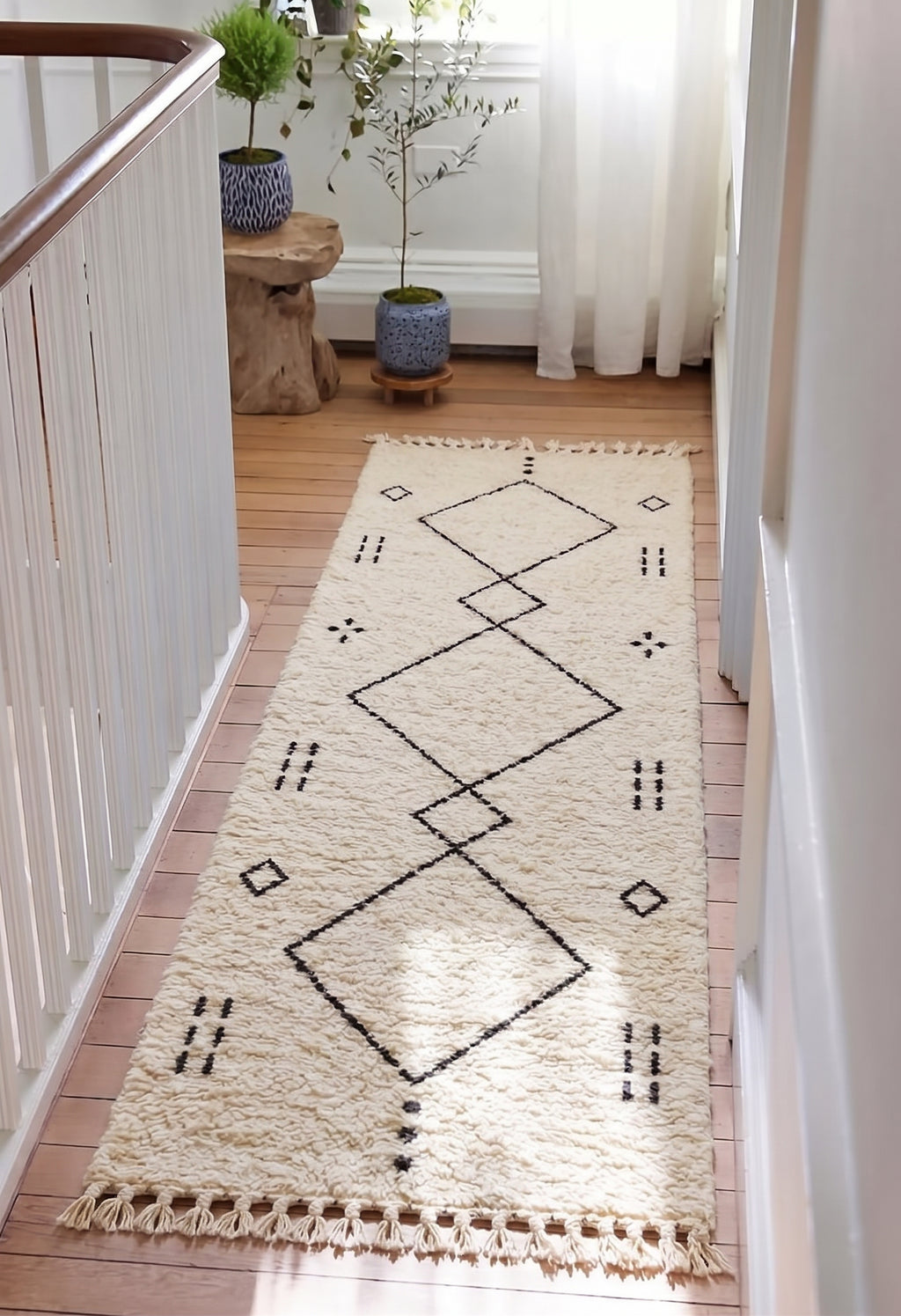 Beni Ourain runner with large charcoal diamonds in a hallway