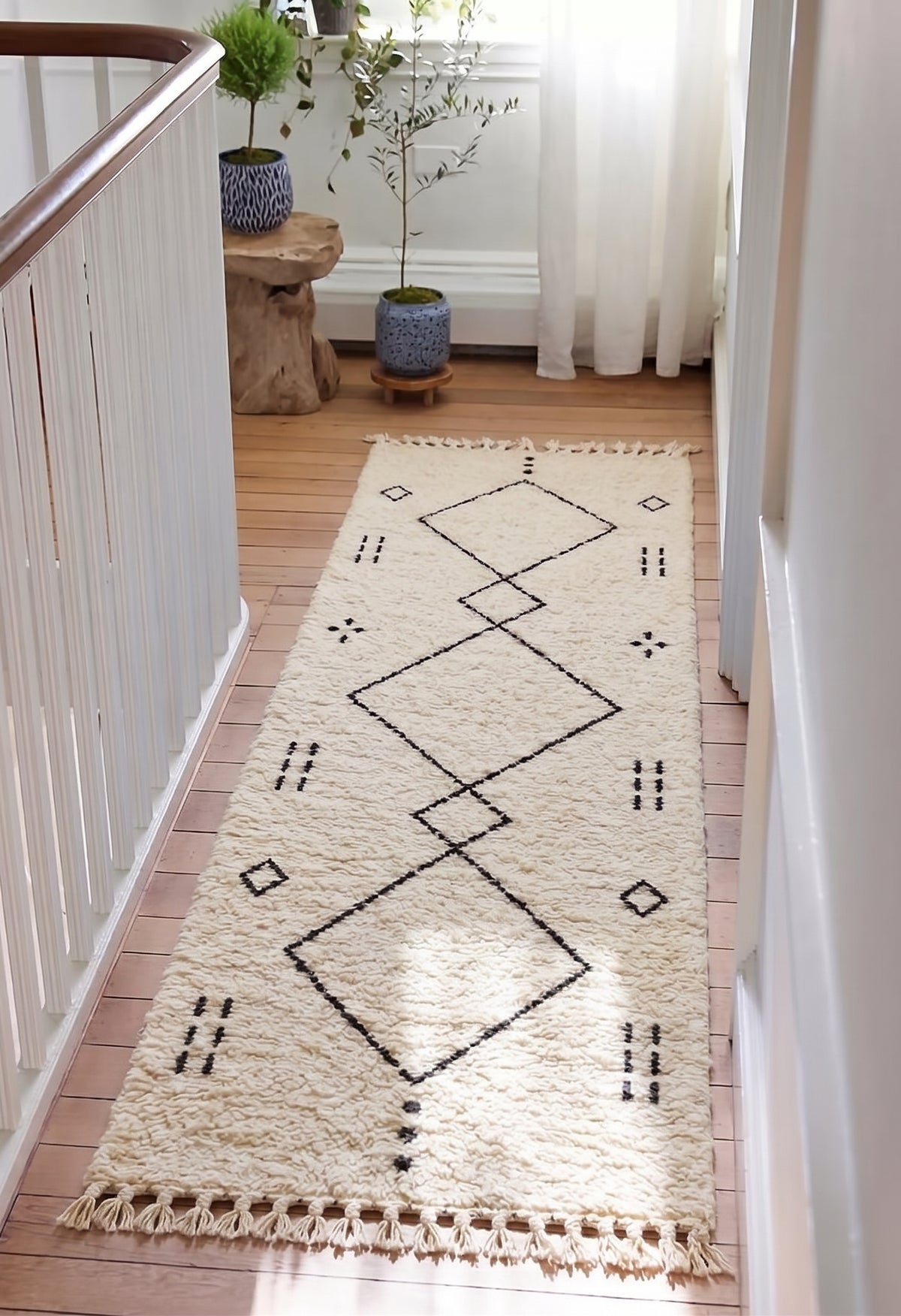 Beni Ourain runner with large charcoal diamonds in a hallway
