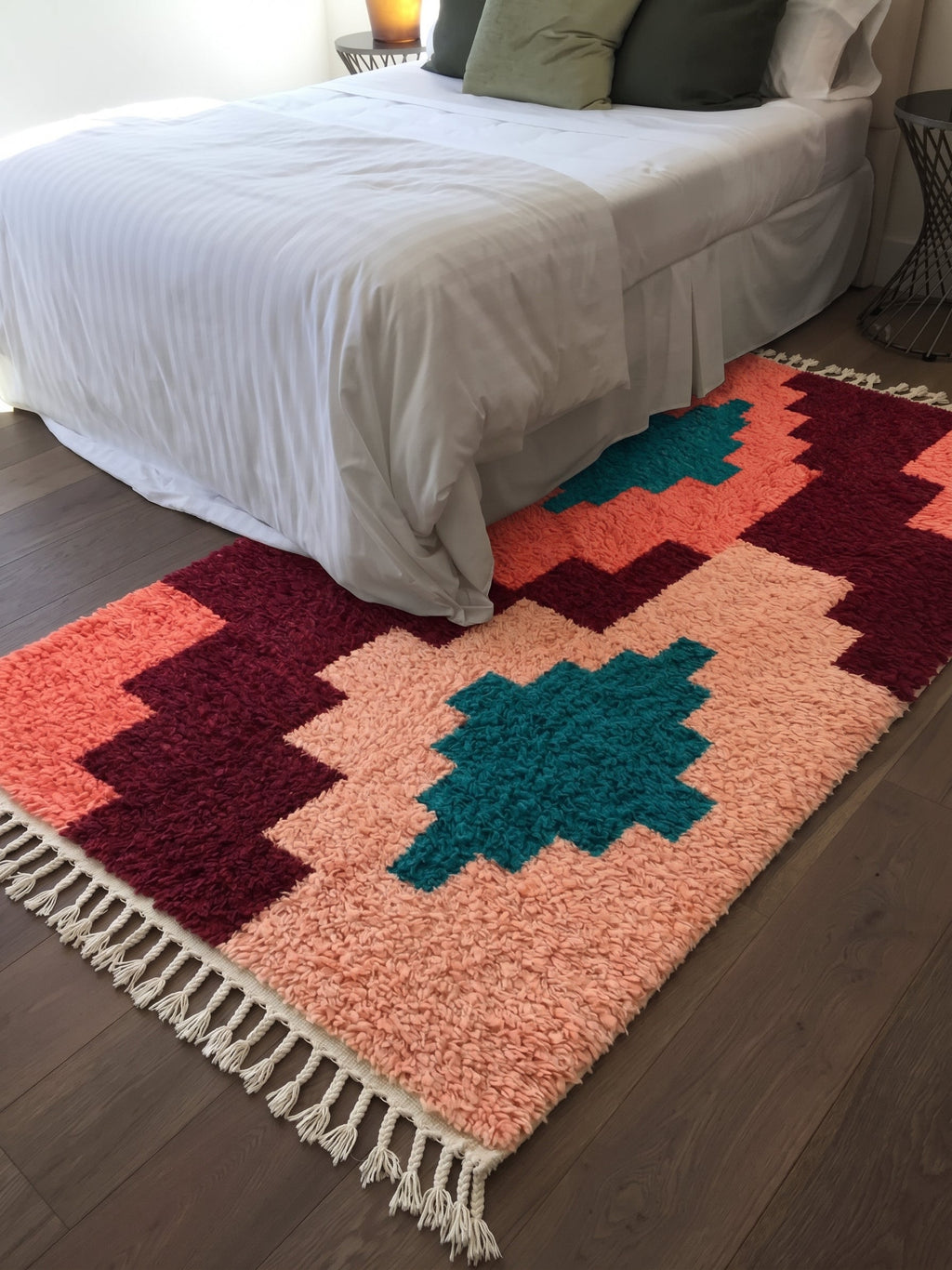 Coral Tilelli Boujaad rug with teal diamonds in a bedroom