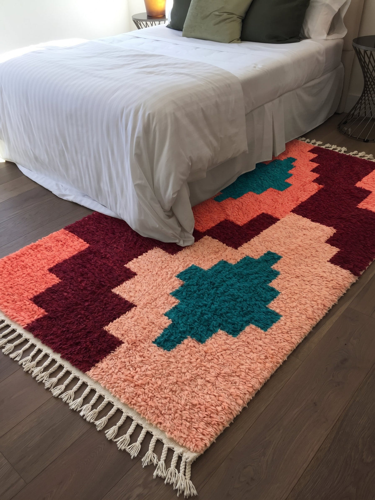 Coral Tilelli Boujaad rug with teal diamonds in a bedroom