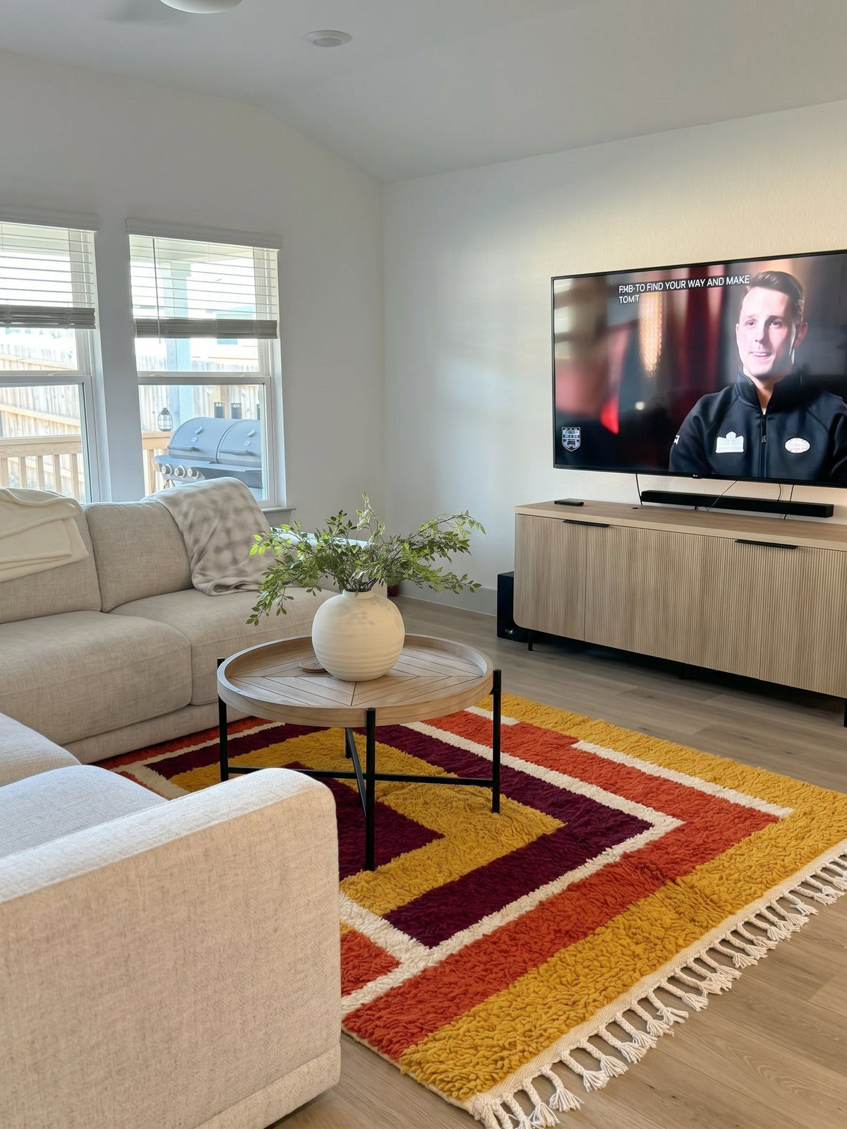 Mustard Tafukt Boujaad rug in a bright living room