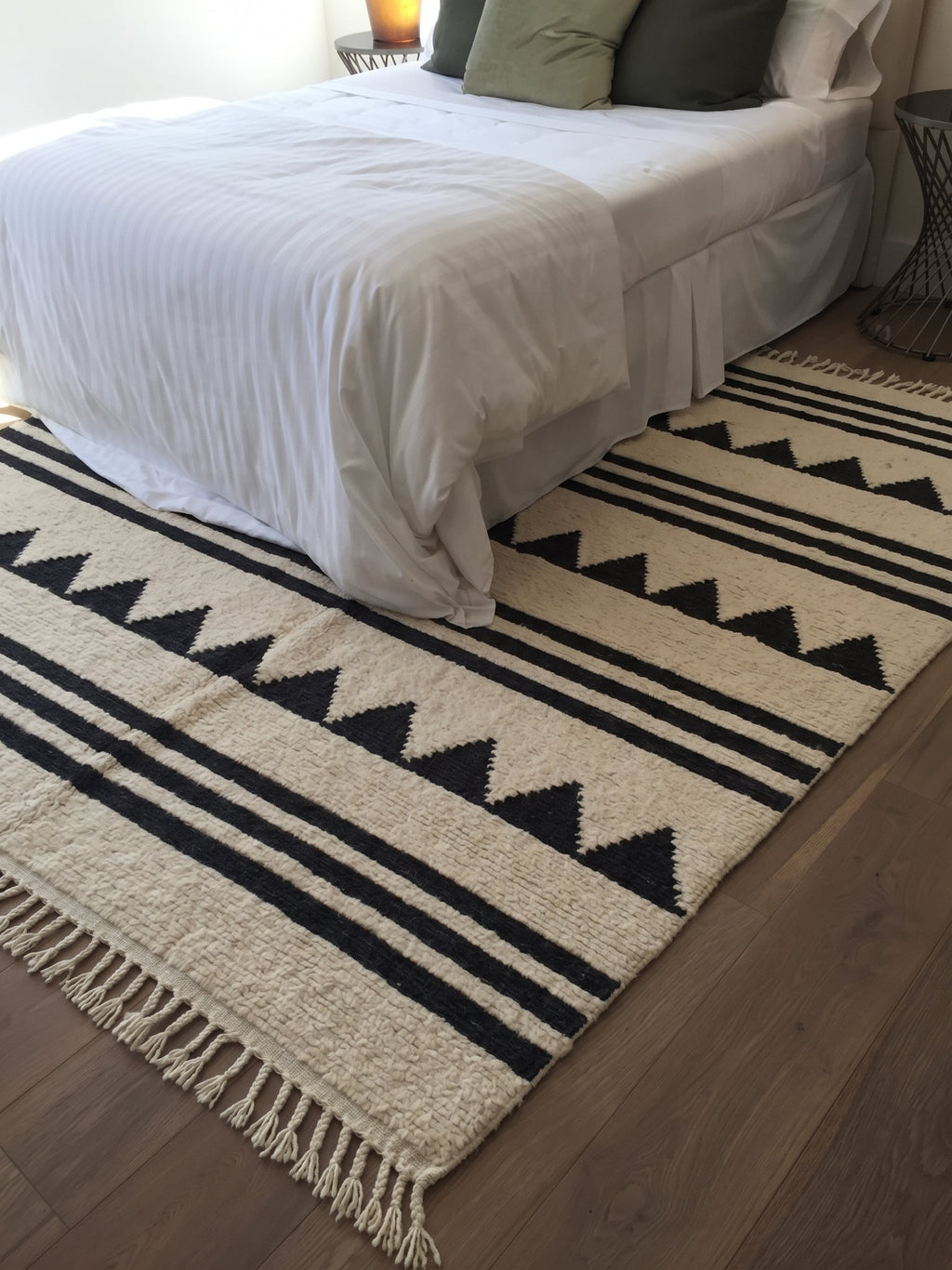 Tiski kilim with charcoal stripes in a bedroom