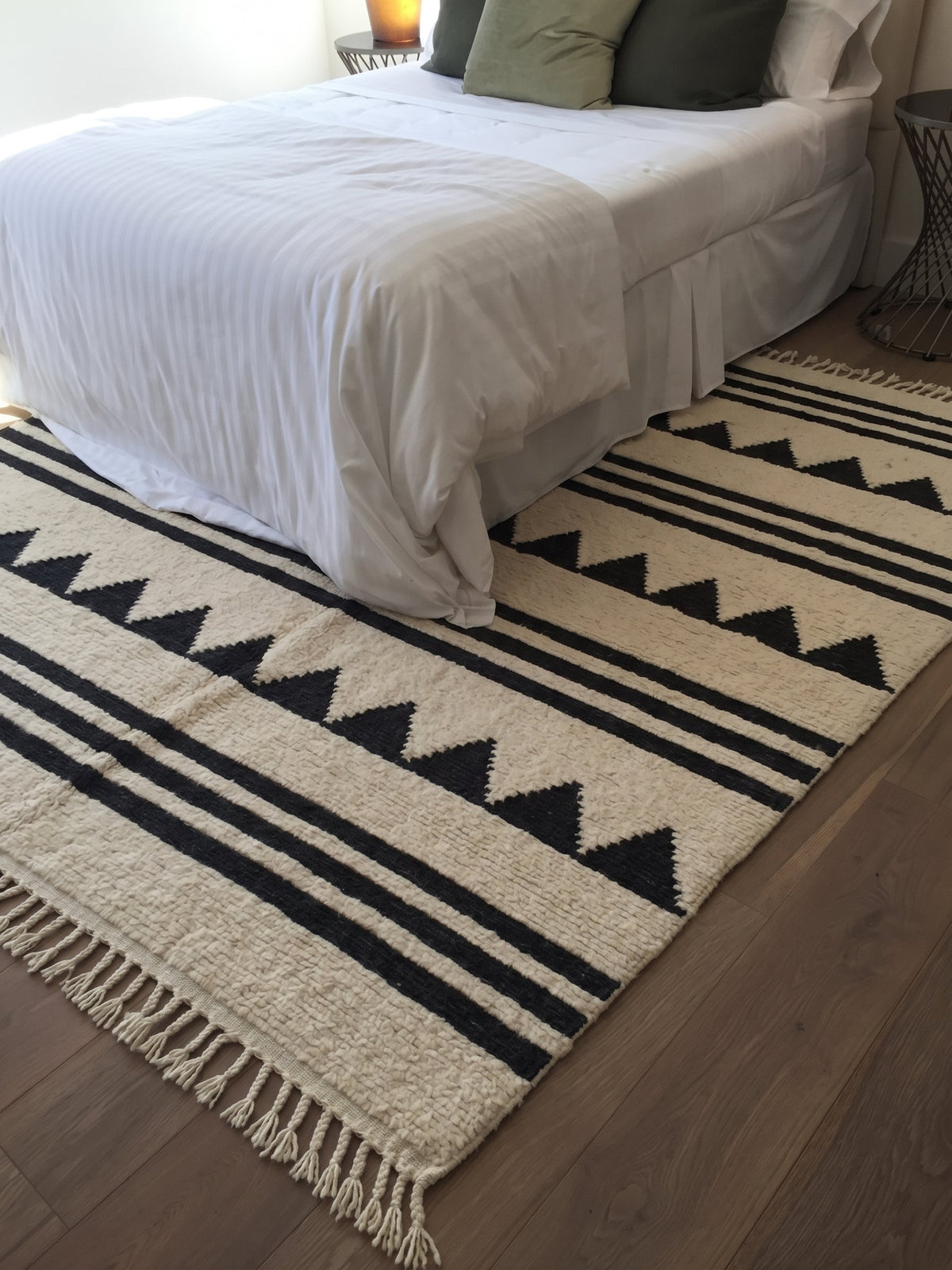 Tiski kilim with charcoal stripes in a bedroom