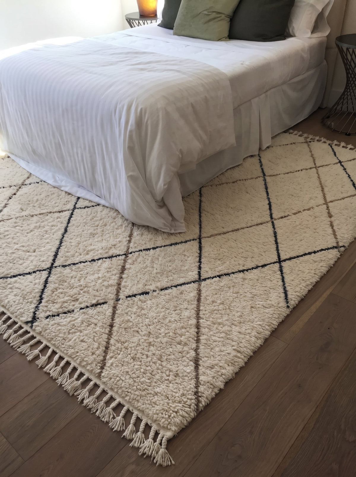 Ivory Beni Ourain rug with fine diamond lattice in a bedroom