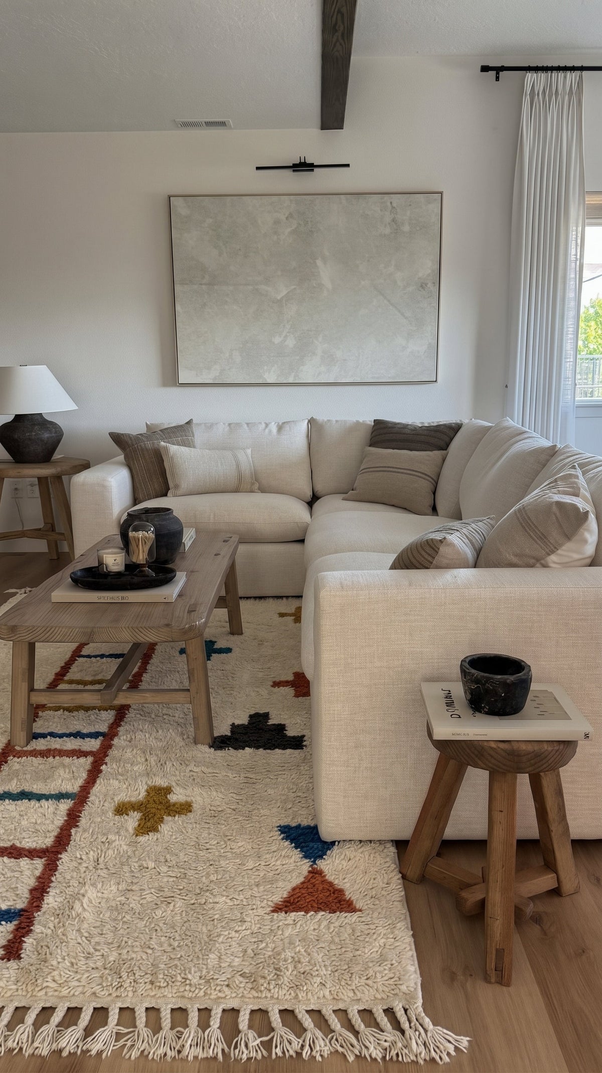 Ivory Azilal rug with a terracotta ladder and crosses in a living room