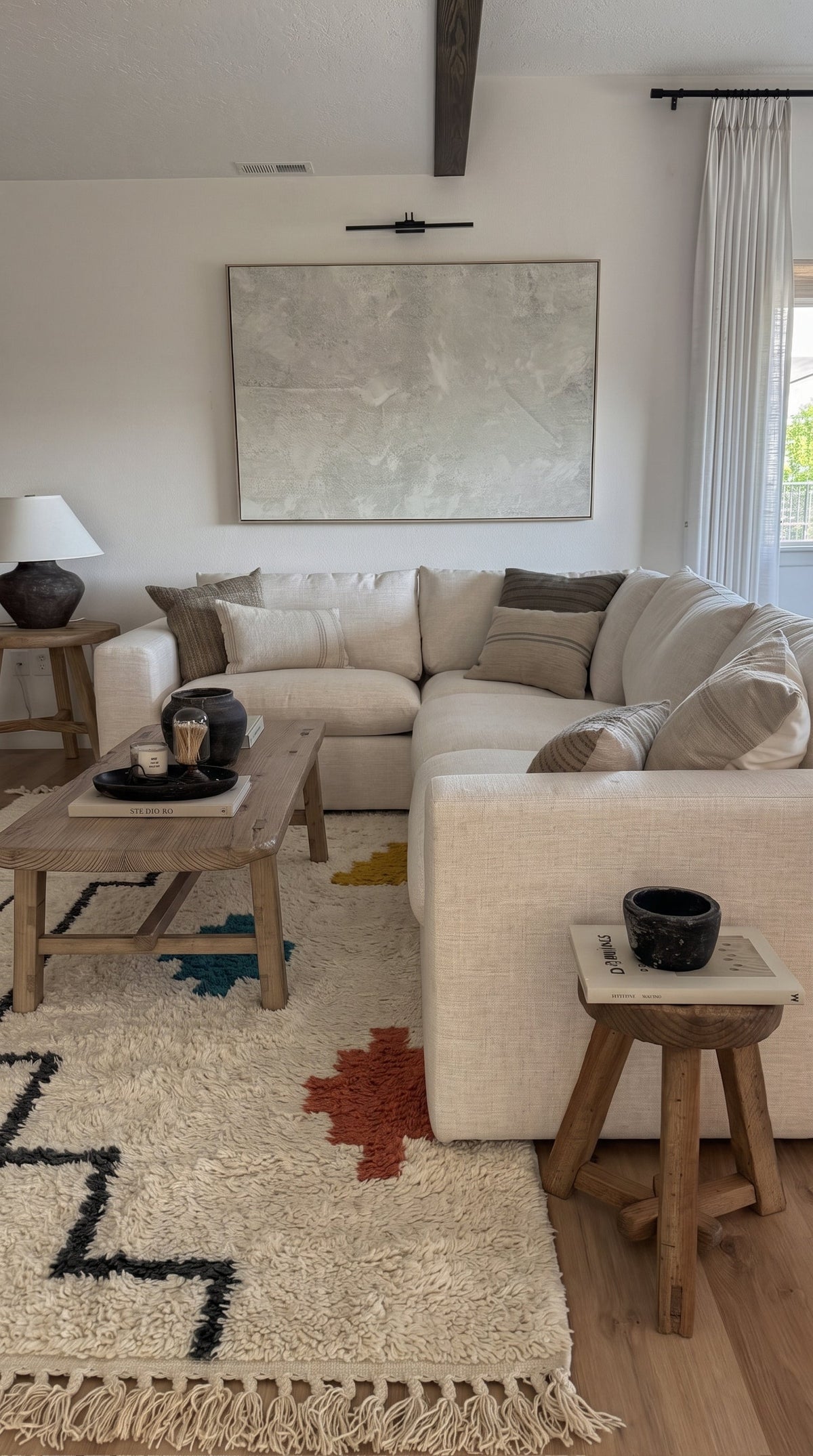 Ivory Azilal rug with a stepped black line and symbols in a living room
