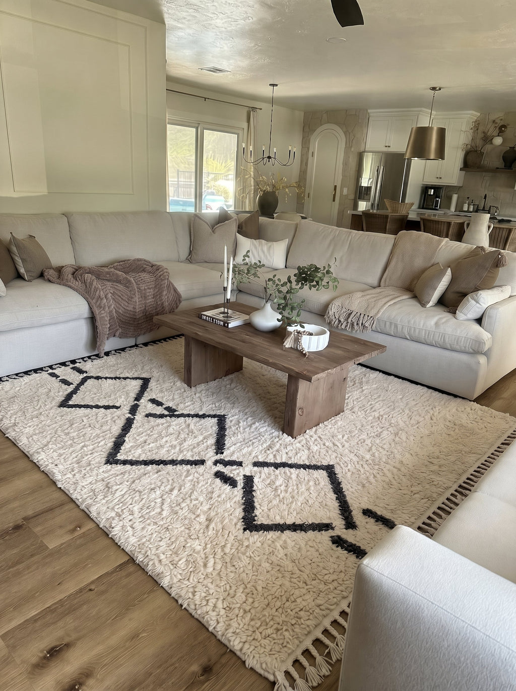 Ivory Beni Ourain rug with charcoal diamond chain in a living room