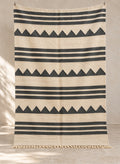 Ivory Tiski kilim with charcoal stripes and triangles, full view