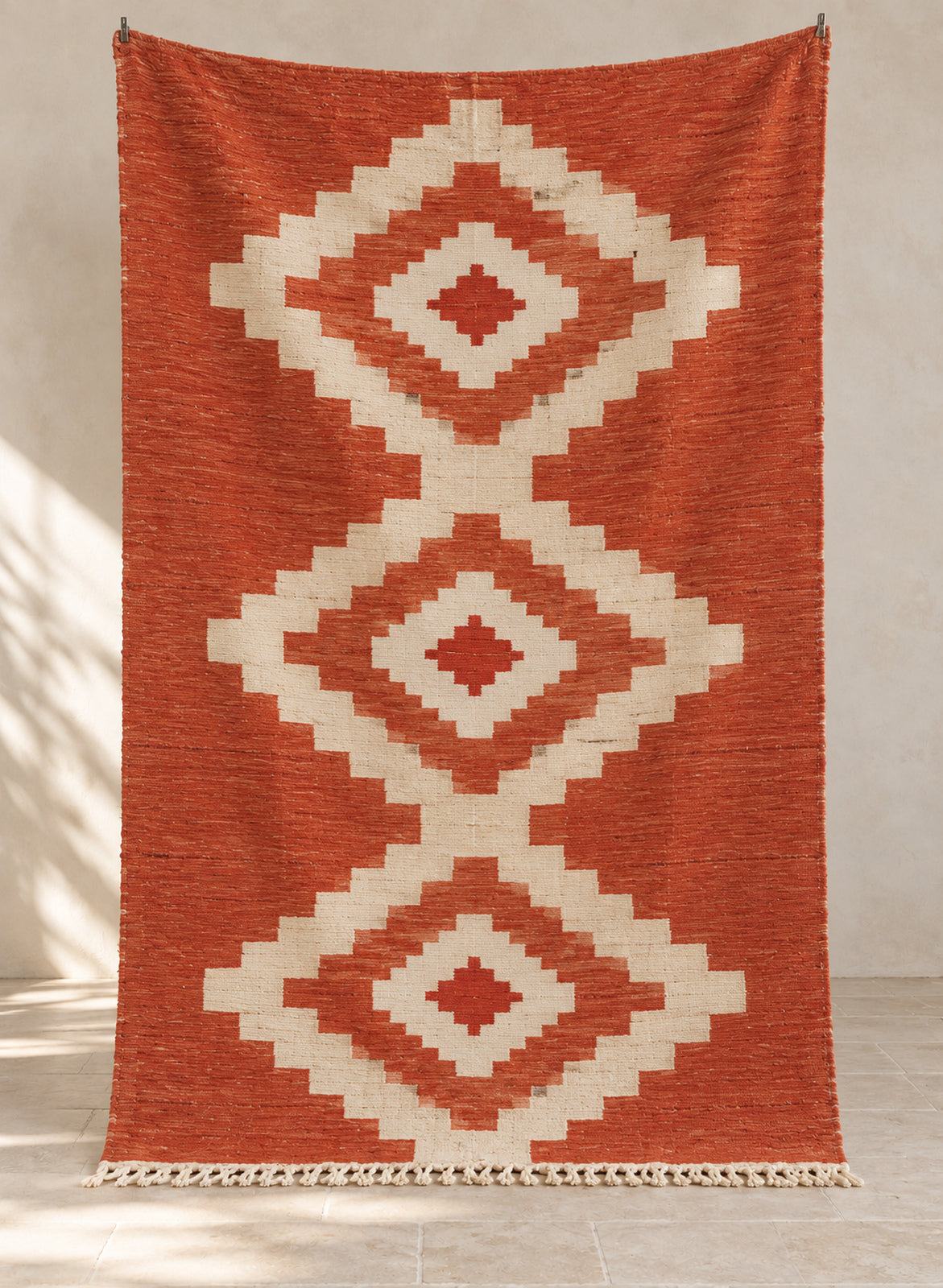 Terracotta Taslit kilim with ivory diamond medallions, full view