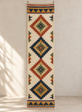 Ivory kilim runner with rust and navy diamond medallions