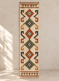 Ivory kilim runner with rust and green hooked medallions