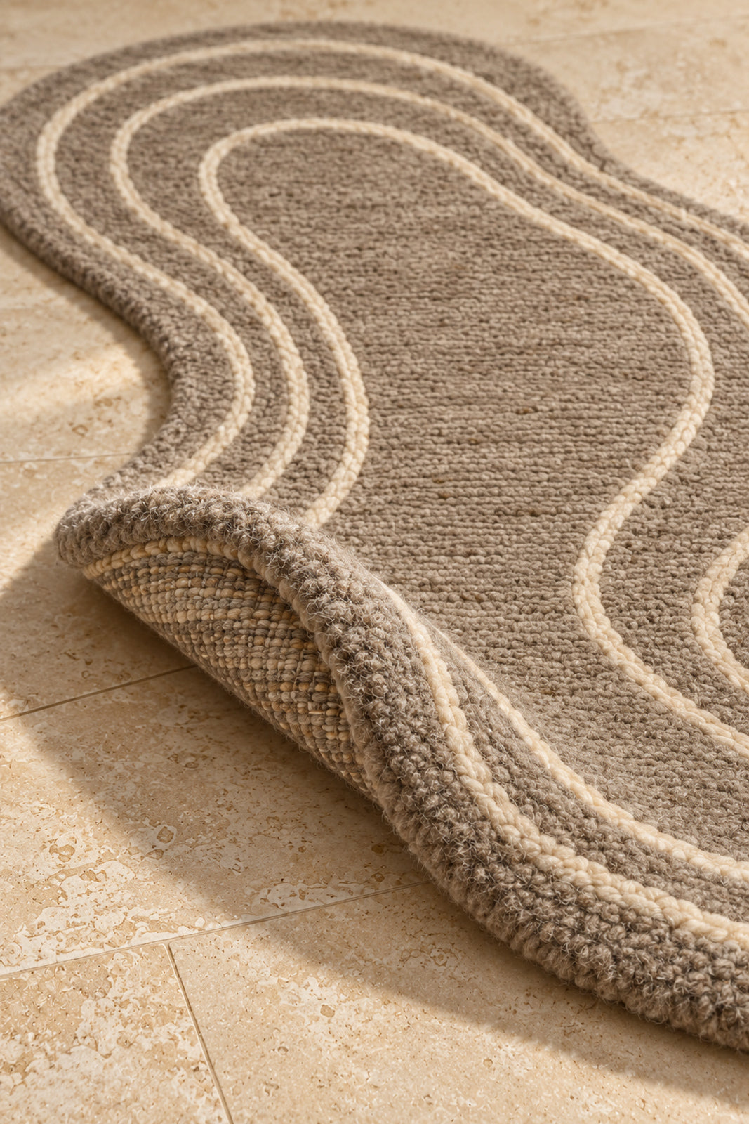 Thick pile of Beni Ourain shaped rug model TF-02 on a folded corner