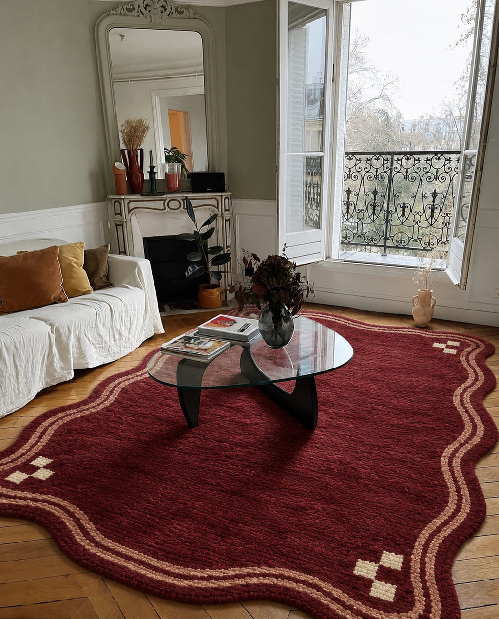Burgundy Beni Ourain rug with a scalloped ivory border in a styled interior