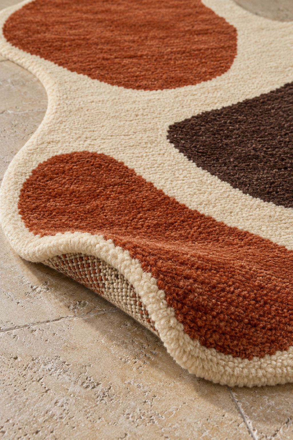 Thick pile of Beni Ourain shaped rug model TF-08 on a folded corner
