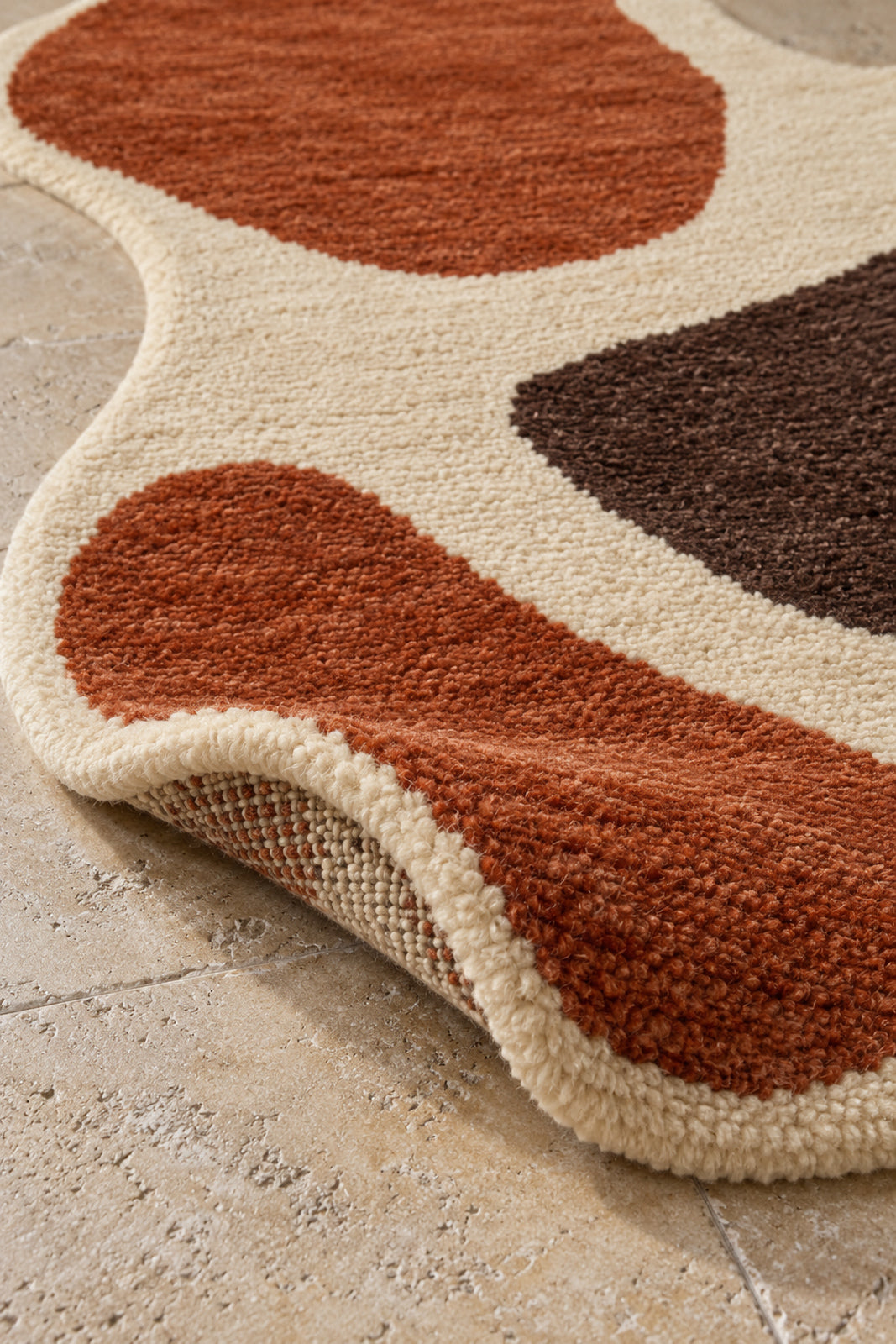 Thick pile of Beni Ourain shaped rug model TF-08 on a folded corner