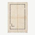 Tapis Azilal ivoire à bordure charbon – Atlas Contour